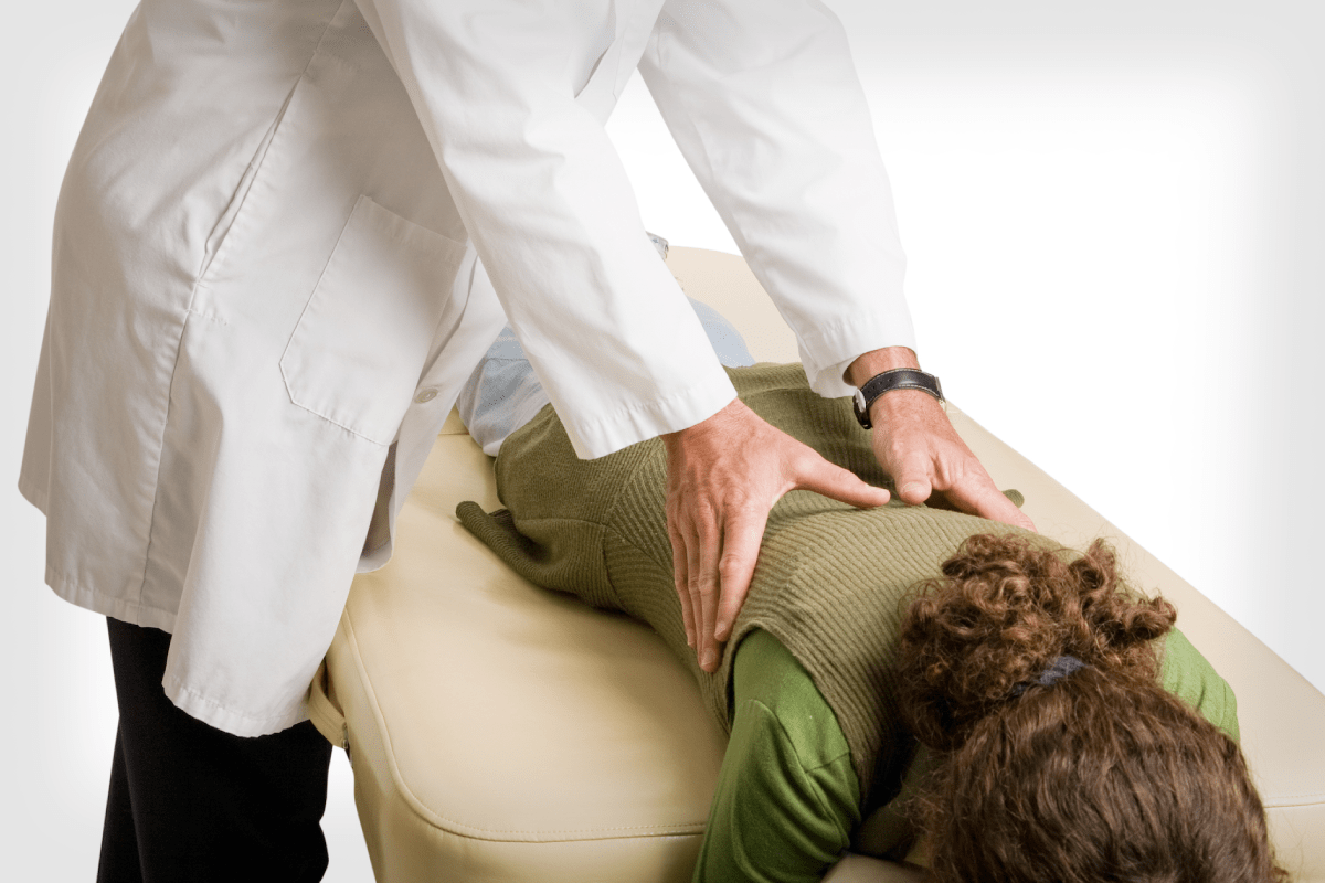 Lady getting a Chiropractic Adjustment